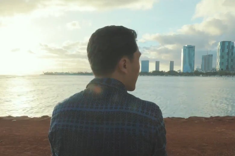 Kaniela Ing sits on a beach in Hawaii.